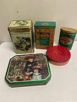 Group shot of all five tins