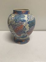 Front view of ceramic grape motif vase