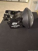 Side view of Vertigo TRI LED showing lens dome and bracket