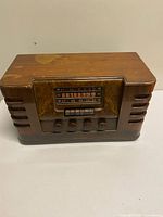 Front view of Westinghouse Model 697 wood radio showing dial, push buttons, knobs
