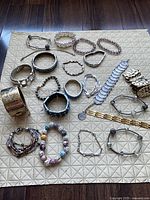 All bracelets laid out on mat