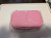 sealed pink zippered case