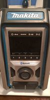 Front view of Makita jobsite speaker showing controls and branding