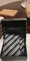 Fascino striped necktie inside branded box