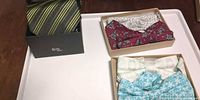 Striped silk necktie boxed with two boxes of bow ties