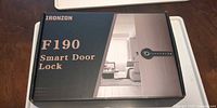 Closed retail box showing Ironzon F190 Smart Door Lock branding