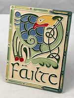 Front of ceramic Celtic plaque showing bird motif and “Fáilte” inscription