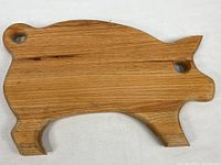 Full view of pig-shaped wooden carving board