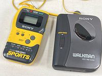 Sony Walkman Sports radio and WM-EX122 cassette player side-by-side
