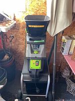 Front view of Earthwise electric chipper/shredder showing hopper, control panel, wheels and frame