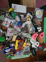 Pile of assorted keychains on table