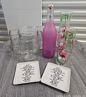 Group shot showing all glassware, vase, pitcher and ceramic dishes