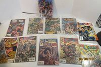 Group shot of 11 bagged Conan comics laid out on table