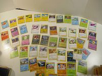 Wide shot of all Pokémon cards laid out showing quantity and mix