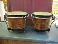 Front view of connected wooden bongo drums