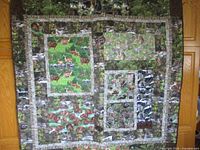 Front patchwork wildlife side of quilt displayed fully