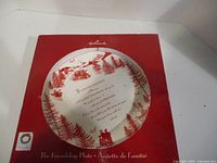 Front of Hallmark box with partial view of plate inside