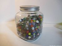 Full view of glass jar filled with marbles