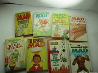 All eight MAD paperbacks laid out for overview
