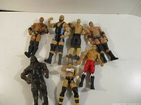All seven wrestling figures laid out