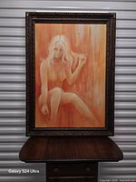 Framed oil painting close view showing subject, signature, and frame detail