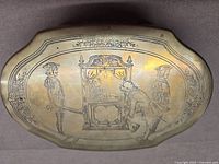 Top view showing full engraved scene and border