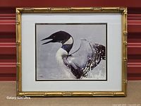 Front view of framed photograph showing image, mat and gold bamboo frame