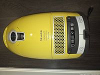 Top view of yellow Miele Complete C3 canister showing control panel and bag cover