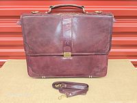 Front view of burgundy leather Renwick briefcase with shoulder strap