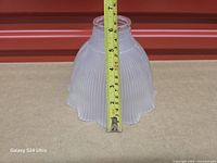 Side view with tape showing height around 4 inches