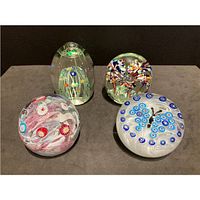 Group shot of all four paperweights