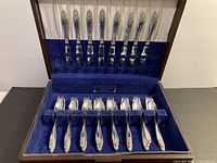 Full view of open flatware chest showing all pieces