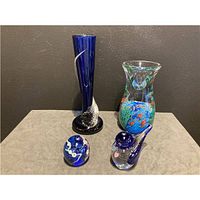 Group shot of four Lillique Studios glass pieces