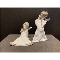 Front view of both figurines showing poses and condition