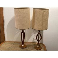Front view of both teak lamps with shades