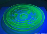 Top view showing concentric rings and UV fluorescence of uranium glass dish