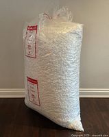 Full view of the 48-inch tall bag filled with white packing peanuts