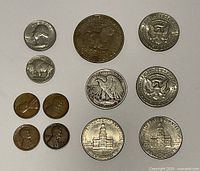 Reverse views displaying key design elements such as Independence Hall, Great Seal, buffalo, wheat ears and Liberty Bell design