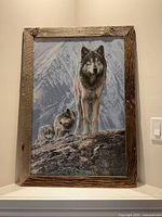 Full view of framed wolf print showing image and wood frame