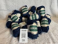 Grouped view of all 16 yarn balls with labels visible