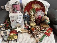 Group shot of all Christmas items including boxed Deco Ball, serving plate, musical figures, ornaments and signs