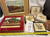 Group view of placemats, loose coasters, boxed items, wooden coaster