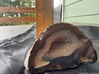 Front view of agate geode showing polished face with quartz cavity