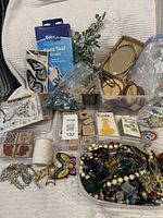 Overall view showing stamps, jewellery tub, wood rounds, QuicKutz box