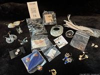 Group shot of all jewellery items on black background