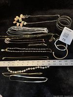 Group shot of all jewellery on black surface