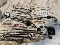 Overview of all necklaces laid out on towel