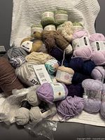 Group shot of assorted yarns showing quantity, colors and brands