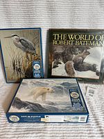 Book and two puzzle boxes displayed together