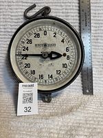 Front view of Detecto hanging milk scale with ruler for scale